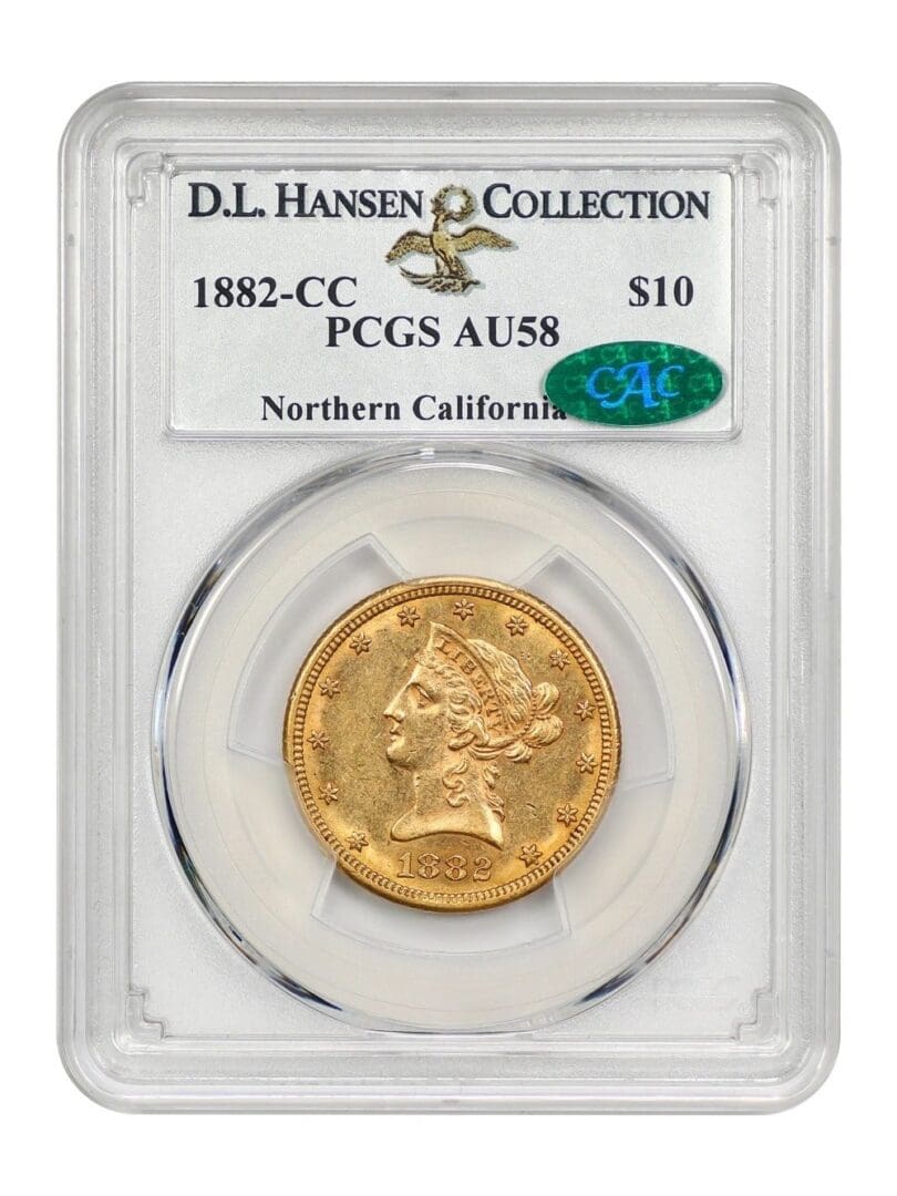 A gold coin is on display in front of the logo for d. L. Hansen collection.